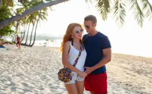 young-couple-in-love-happy-on-summer-beach-togethe-2023-11-27-05-25-42-utc-1300×806