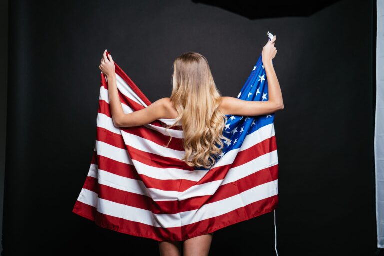 beautiful blonde woman nude wrapped in american flag
