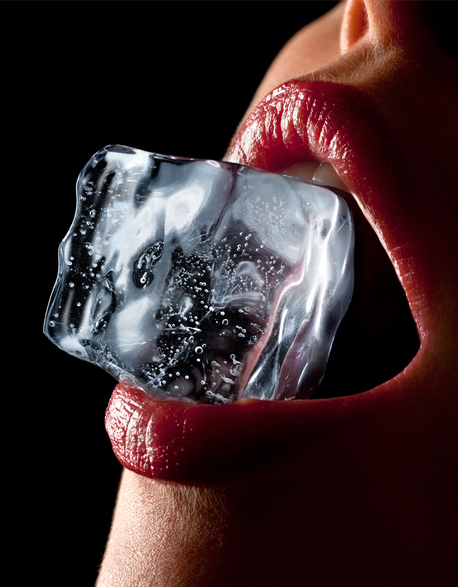 ice cube in woman's mouth